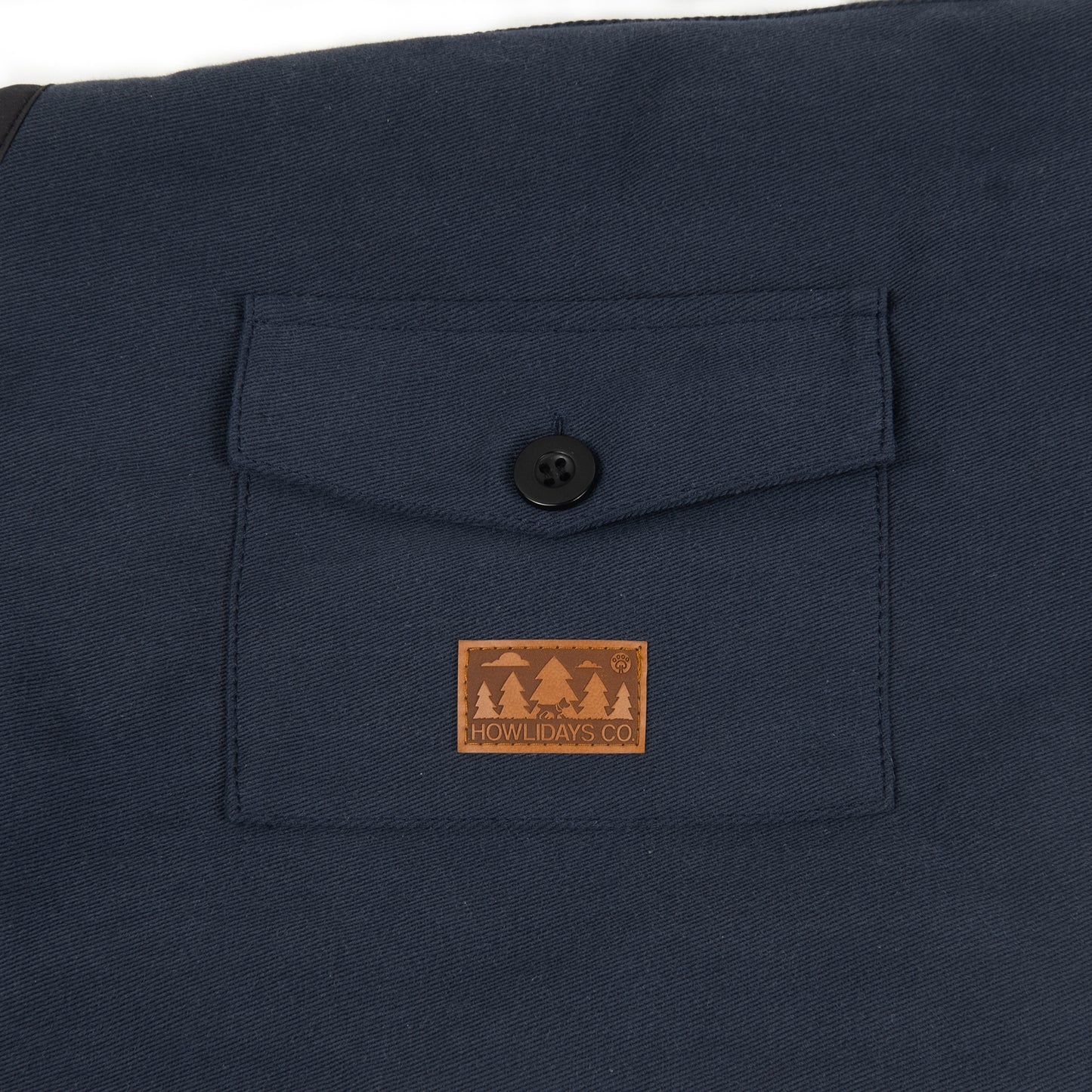 Close-up of a functional pocket on a winter dog coat, ideal for small essentials like treats or waste bags.
